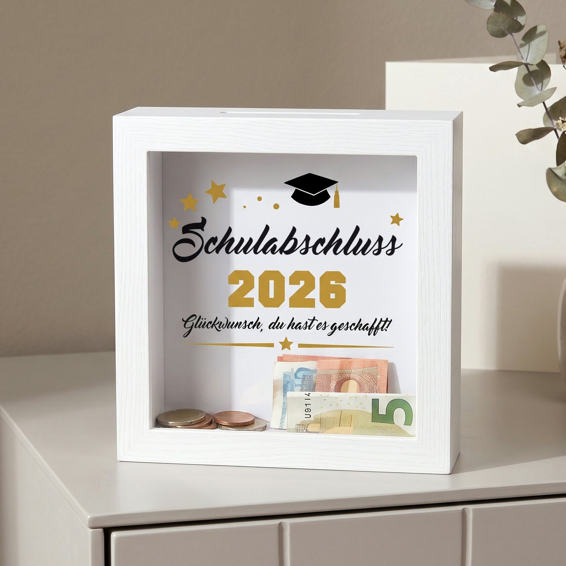 Bilderrahmen-Spardose „Schulabschluss 2026“ mit Geldscheinen und Münzen als Abschlussgeschenk