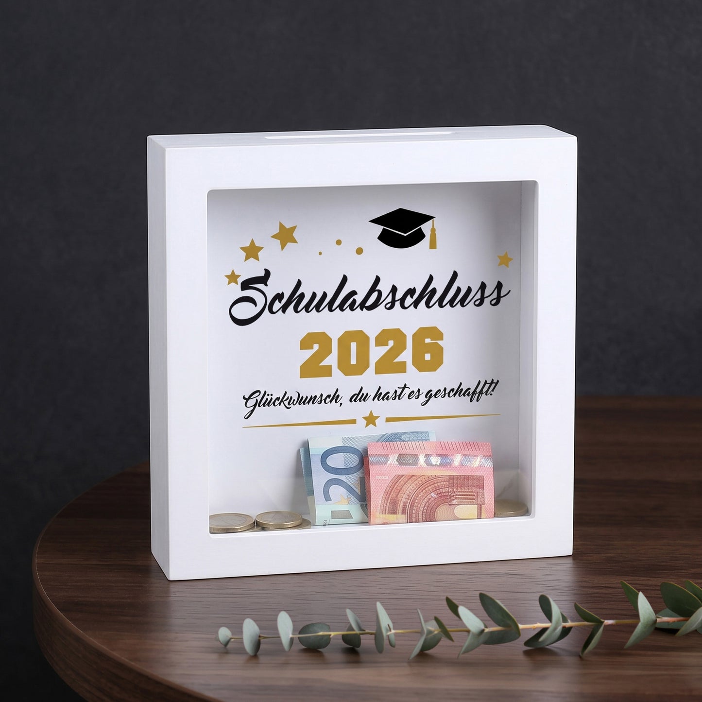 Bilderrahmen-Spardose „Schulabschluss 2026“ mit Geldscheinen und Münzen als Abschlussgeschenk