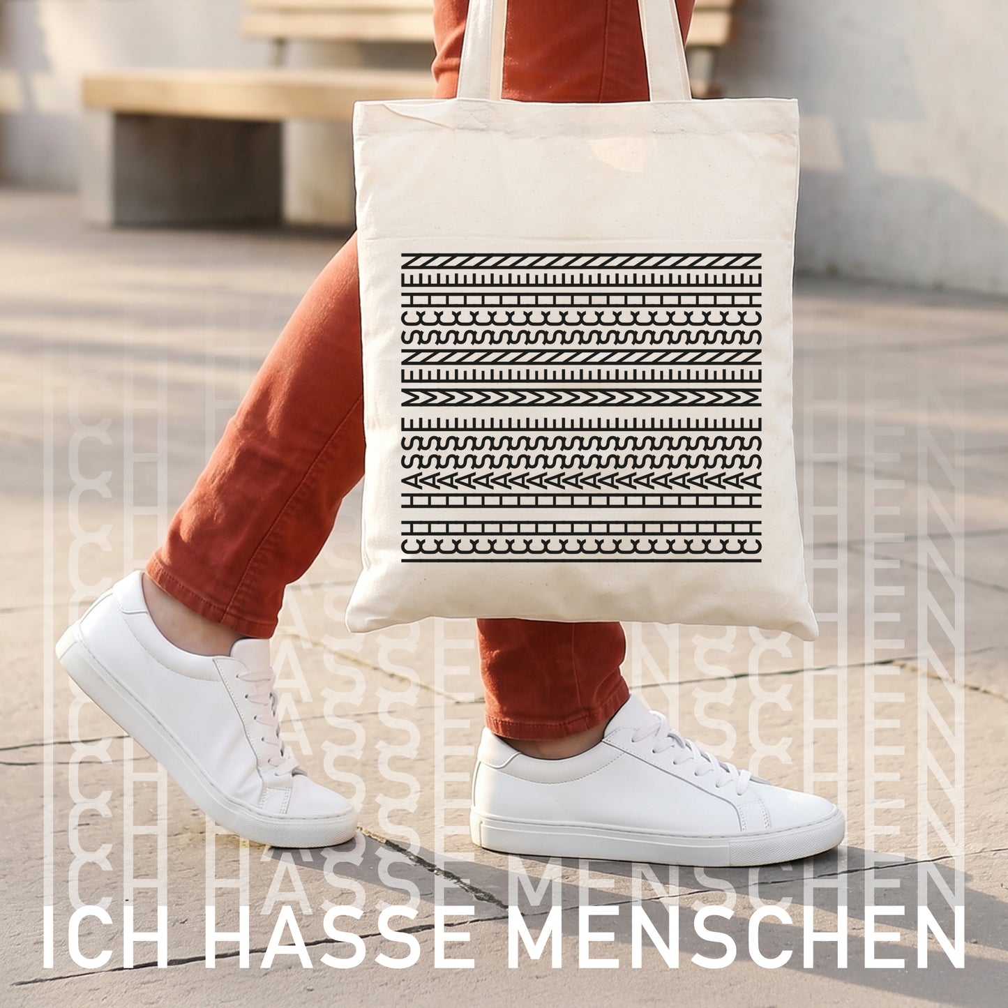 Baumwollbeutel mit Aufdruck „Ich hasse Menschen“ neben Zimmerpflanze, Kopfhörern, Bürste und Alltagsgegenständen