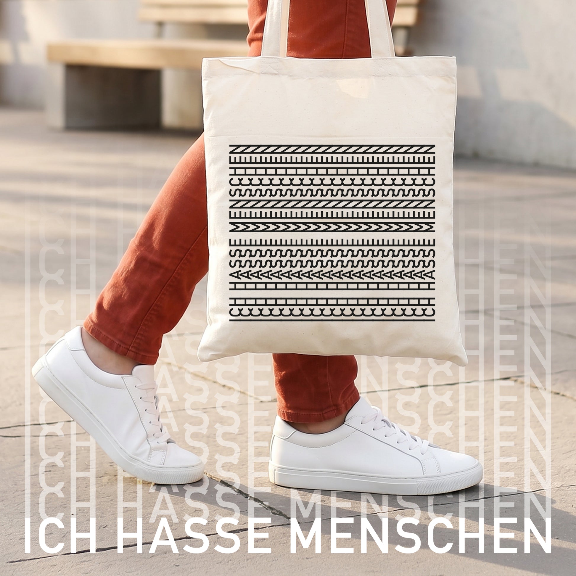 Baumwollbeutel mit Aufdruck „Ich hasse Menschen“ neben Zimmerpflanze, Kopfhörern, Bürste und Alltagsgegenständen