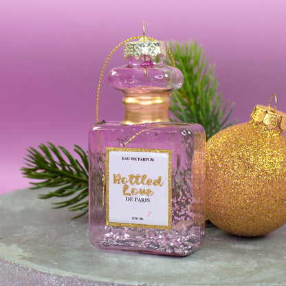 Rosafarbener Parfümflakon aus Glas mit goldenen Details und Glitzer als Christbaumschmuck