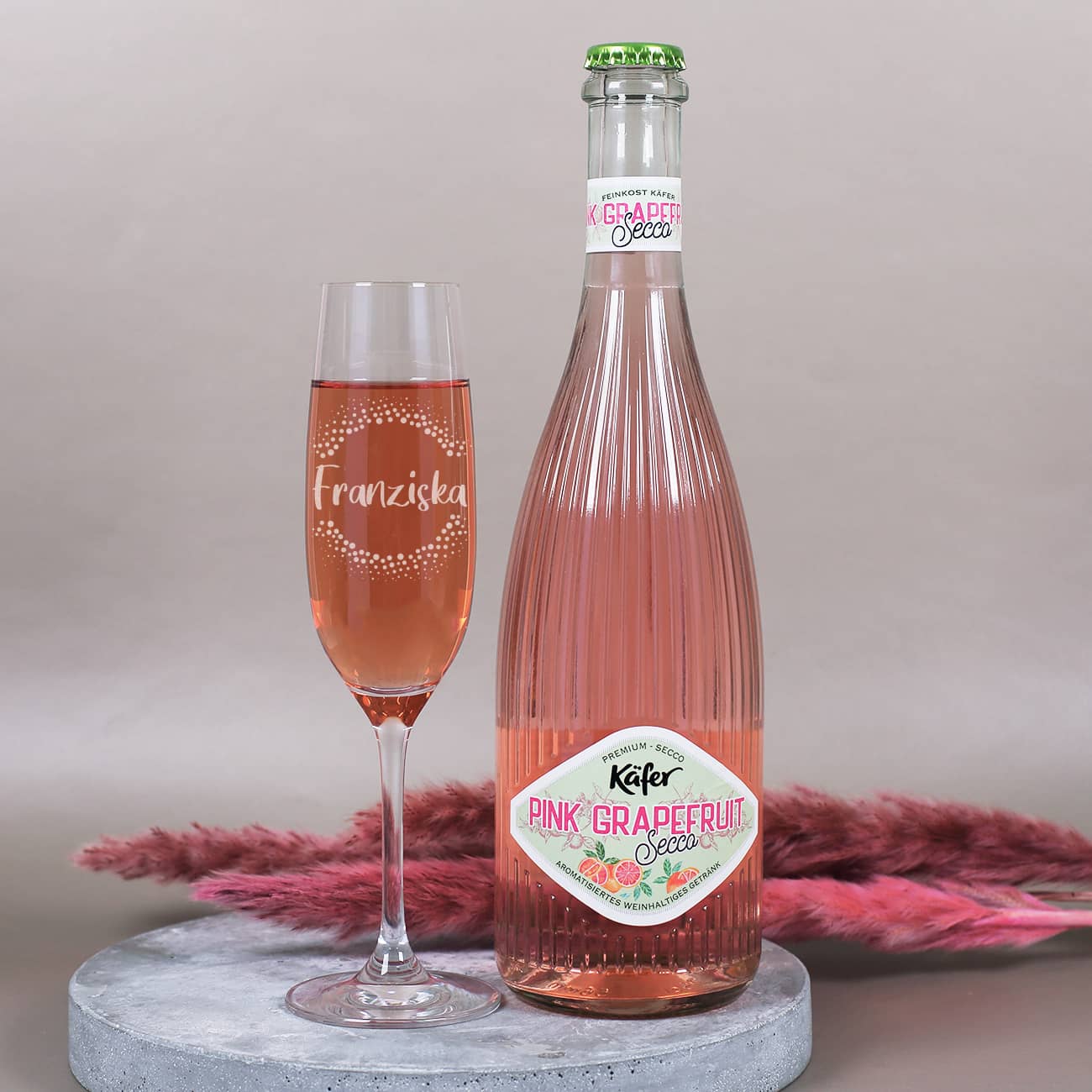 Grapefruit Secco von Käfer und Sektglas mit Namensgravur