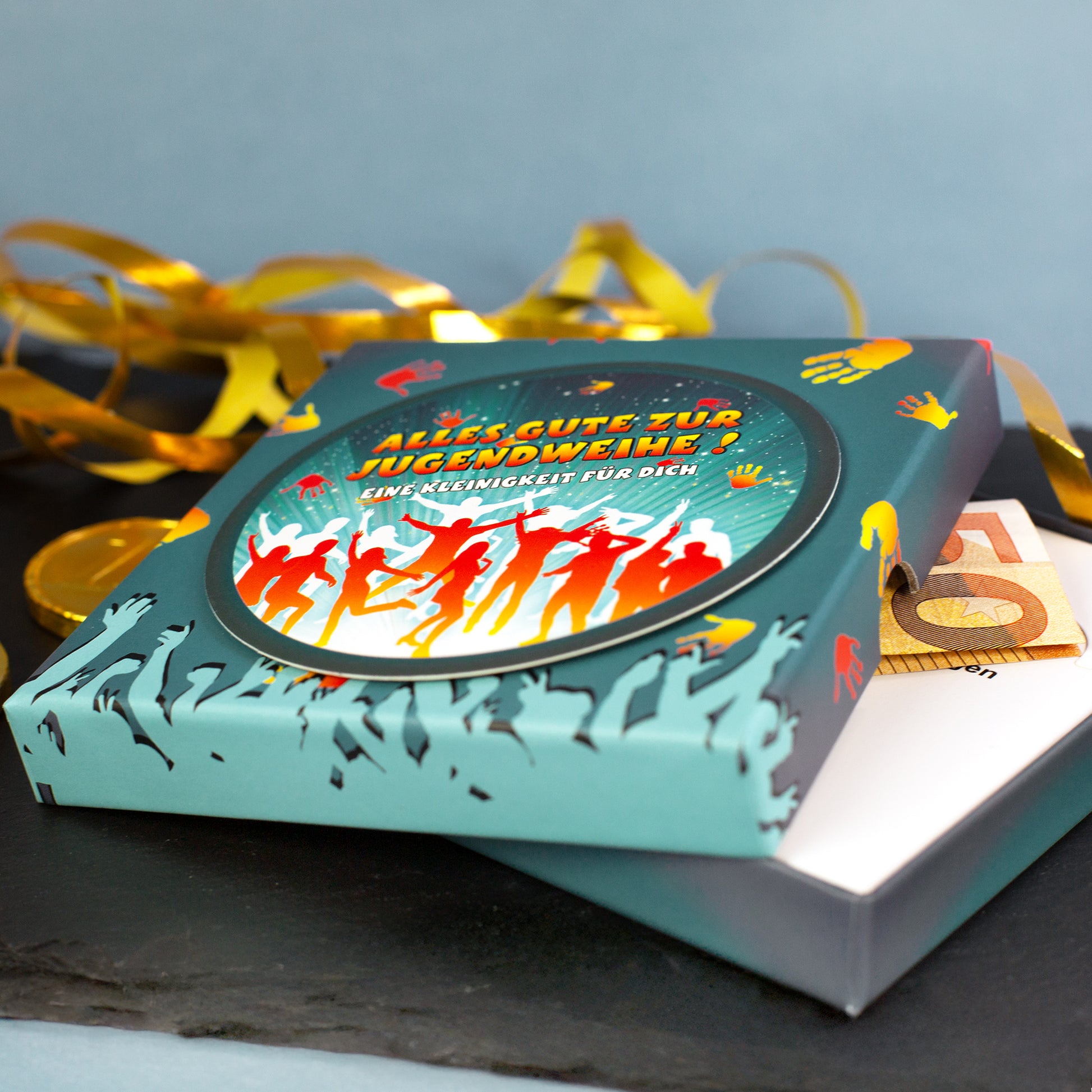Geschenkschachtel zur Jugendweihe mit Geldschein als Beispiel für Geldgeschenk